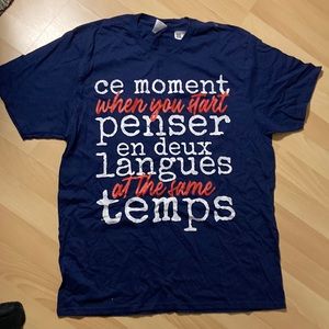 Navy shirt with French-English bilingual phrase,  This Moment To Think.